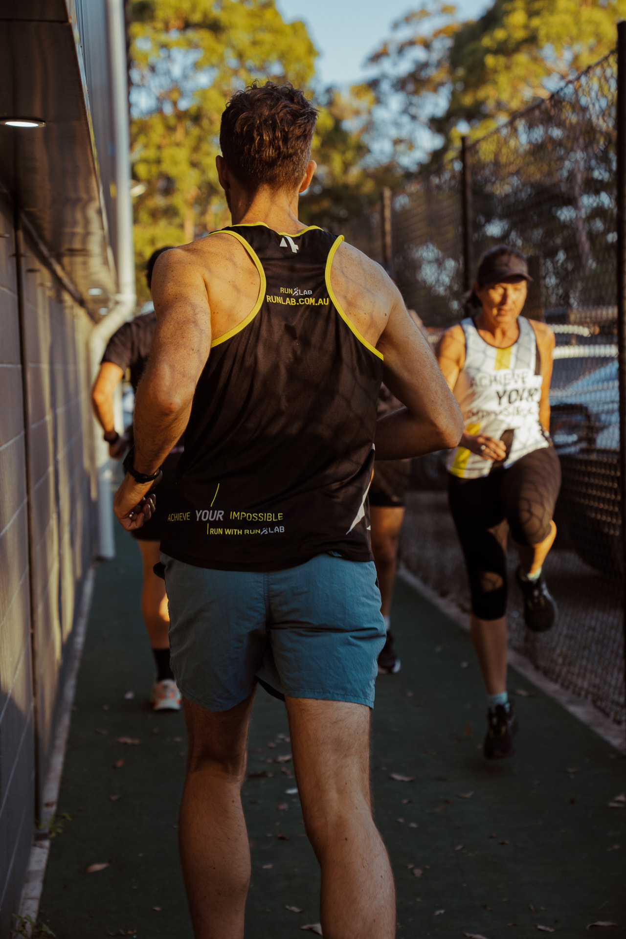 Runners in RunLab singlets on an early morning session